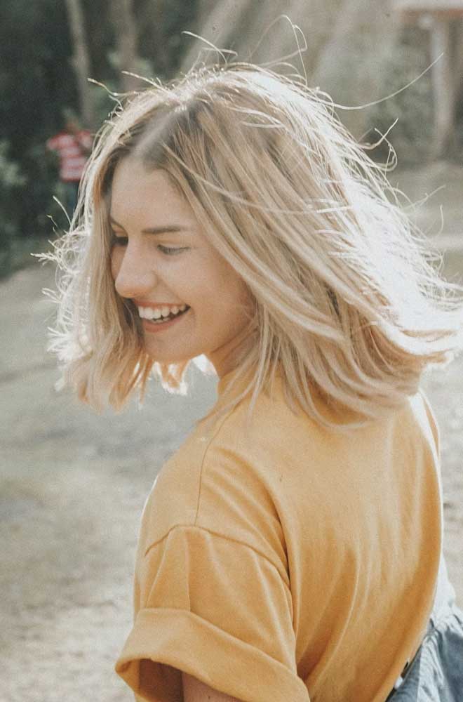 Happy young woman laughing